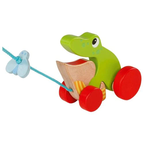Learning to walk is easier and more fun with a silly wooden frog at your side.